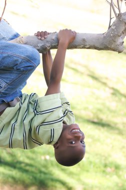 Young Boy Having Fun In The Park clipart