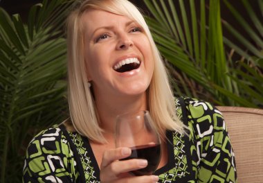 Beautiful blonde laughs at a Party clipart