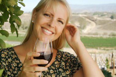 Beautiful Woman Sips Wine in Vienyard clipart