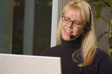 Businesswoman with Phone Headset clipart