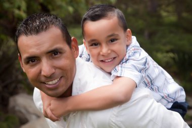 Hispanic Father and Son Having Fun clipart