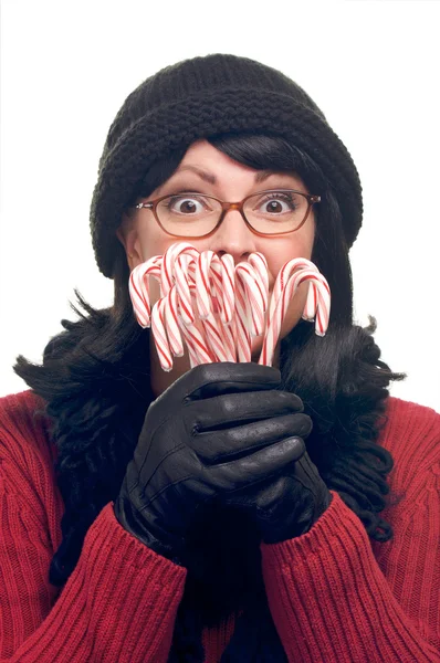 Mujer en blanco sosteniendo bastones de caramelo —  Fotos de Stock