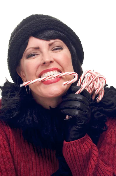 Mujer en blanco sosteniendo bastones de caramelo —  Fotos de Stock