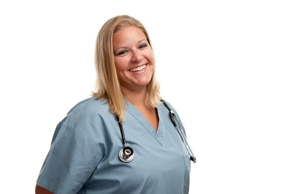 Amichevole donna bionda medico o infermiera — Foto Stock