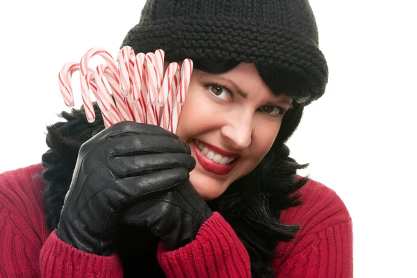 Mujer sosteniendo bastones de caramelo en blanco —  Fotos de Stock