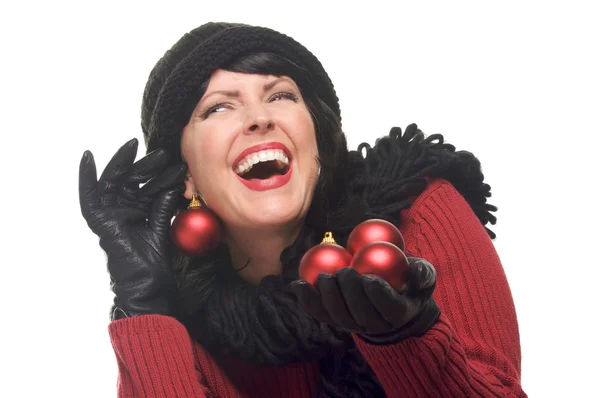 Mujer riendo sosteniendo adornos rojos —  Fotos de Stock