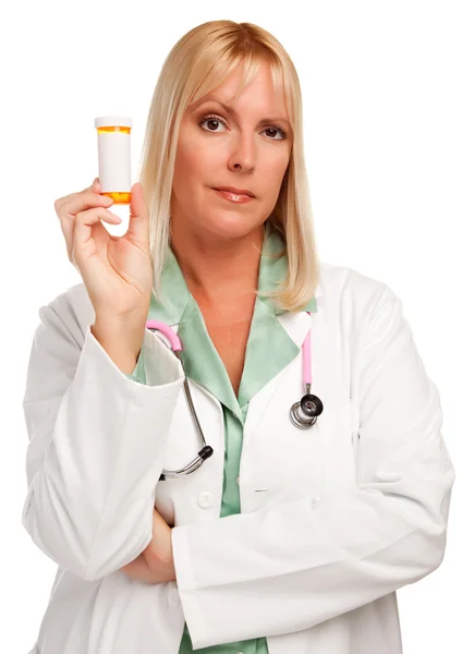 Médica com garrafa de pílula em branco — Fotografia de Stock