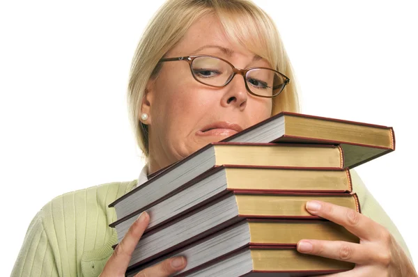 Estudante do sexo feminino luta com livros — Fotografia de Stock