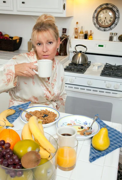 Attractive Woman In Kitchen with Fruit, Coffee, — Stock Photo, Image