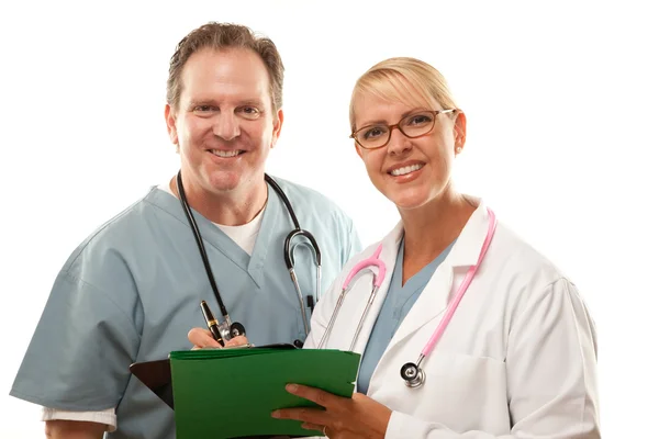 Male and Female Doctors Looking at File — Stock Photo, Image