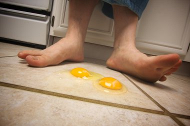 Eggs on the Floor at Mans Feet clipart