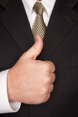 Businessman Gesturing Thumbs Up clipart