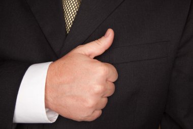 Businessman Gesturing Thumbs Up clipart