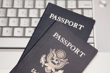 Two Passports on a Laptop Computer clipart