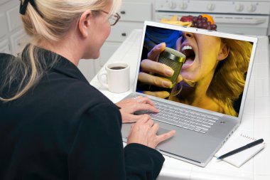 Woman Using Laptop for Music clipart