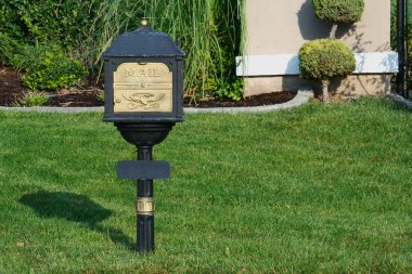 Classic Mailbox Surrounded by Grass clipart