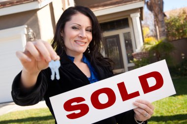 Woman Holding Sold Sign and Keys clipart