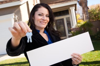Woman Holding Blank Sign and Keys clipart