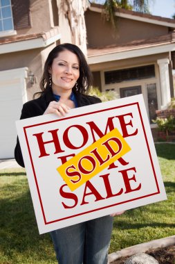 House and Woman Holding Sold Home Sign clipart