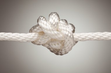 Nylon Rope Knot on a Spot Lit Background clipart