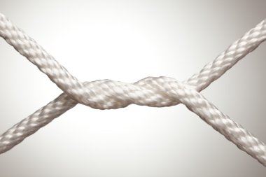 Nylon Rope Knot on a Spot Lit Background. clipart