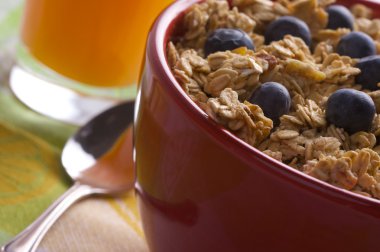 Bowl of Granola, Berries and Juice clipart