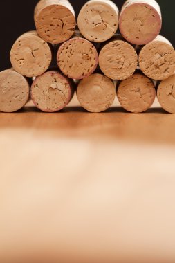 Stack of Wine Corks on a Wood clipart