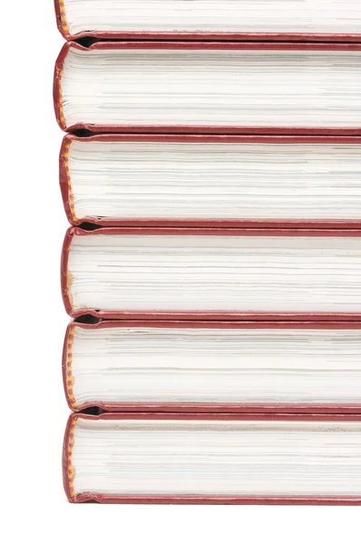 กองหนังสือที่แยกกันบนสีขาว — ภาพถ่ายสต็อก