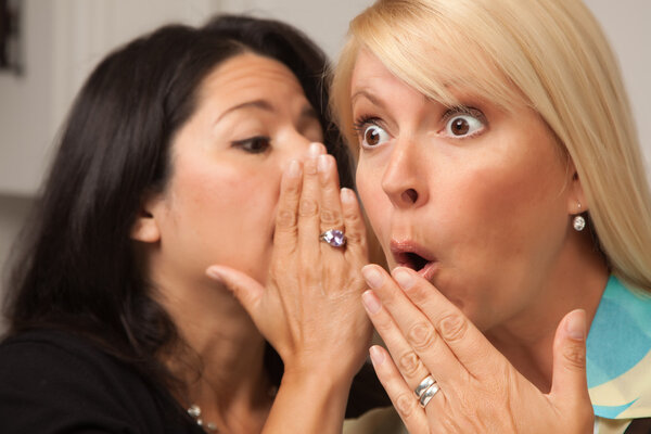 Two Friends Whispering Secrets