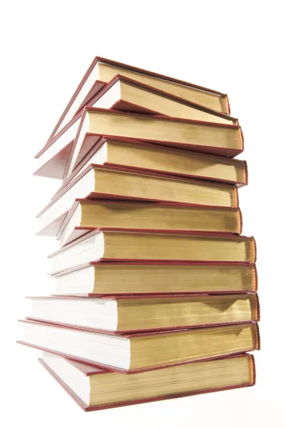 Високий стек книг ізольовано на білому — стокове фото