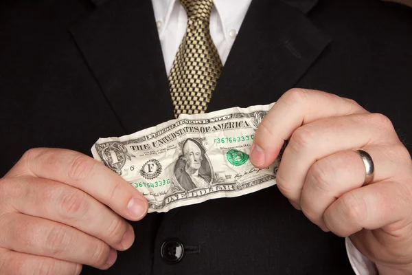 Podnikatel hospodářství vrásčitá dolarové bankovky — Stock fotografie