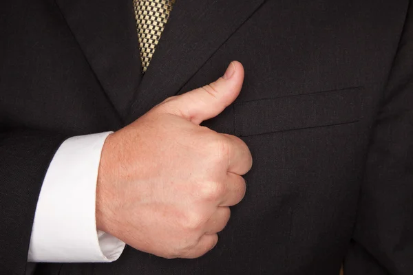 Biznesmen skrzyżowane kciuki — Zdjęcie stockowe