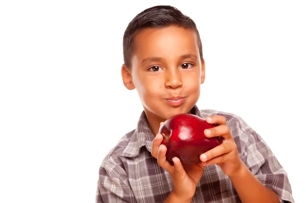 Joven hispano comiendo una manzana roja — Foto de Stock