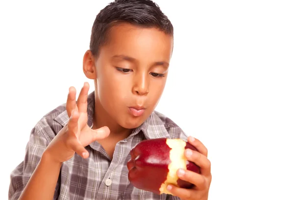 Spanischer Junge isst großen roten Apfel — Stockfoto