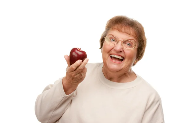 Aantrekkelijke senior vrouw met appel geïsoleerd op een — Stockfoto