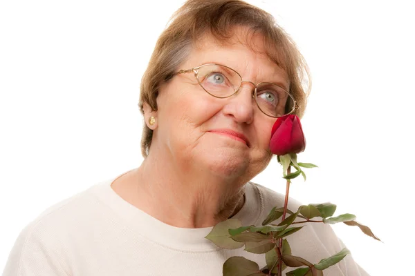 Ελκυστική γυναίκα ανώτερος με κόκκινο τριαντάφυλλο απομονωμένες o — Φωτογραφία Αρχείου