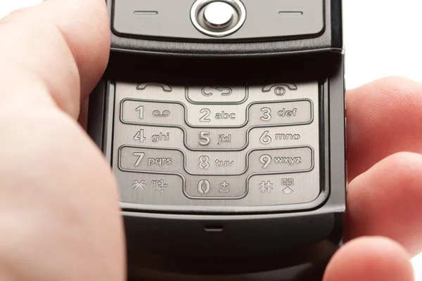 灰色の携帯電話の画像を持っている男性の手 — ストック写真