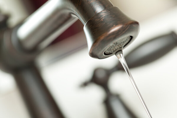 Close-up of Water Dripping from Faucet