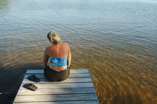 Blonde Woman Relaxing on the Dock — Stock Photo, Image