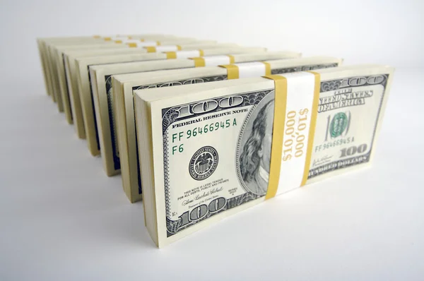 Pilas de billetes de cien dólares en blanco —  Fotos de Stock
