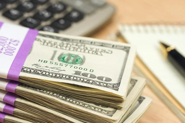 stock image Stack of Money, Calculator, Pad of Paper