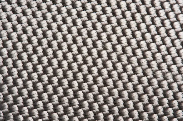 Крепкий нейлоновый ткацкий макро-фон — стоковое фото