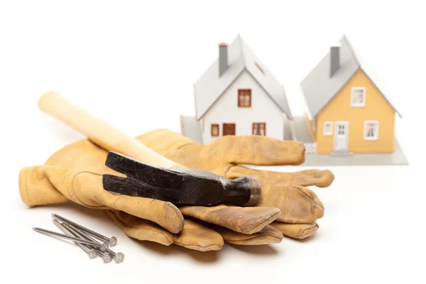 Hammer, Gloves, Nails, Houses on White — Stock Photo, Image