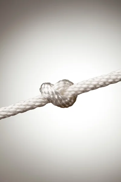 Nylon Rope Knot on a Spot Lit Background — Stock Photo, Image