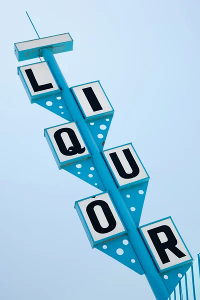 Blue Retro Liquor Sign Against A Clear Sky. — Stockfoto