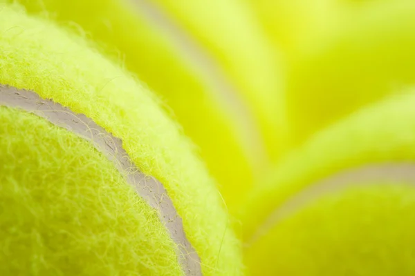 Makro sadu zbrusu nové tenisové míčky. — Stock fotografie