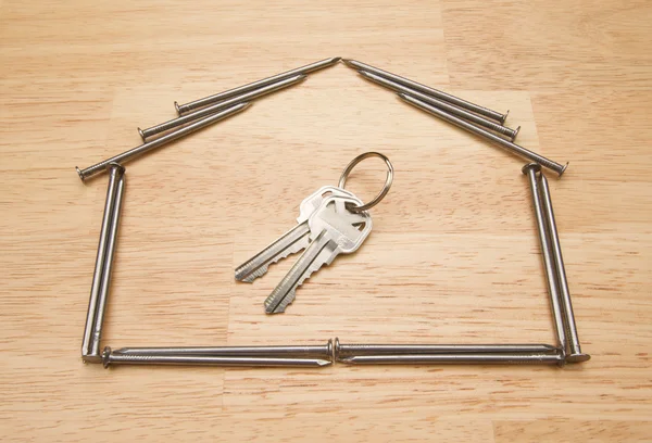 House of Nails with Key on Wood — Stock Photo, Image