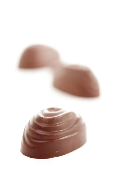 Νόστιμα σοκολατάκια απομονωμένη σε ένα λευκό — Φωτογραφία Αρχείου