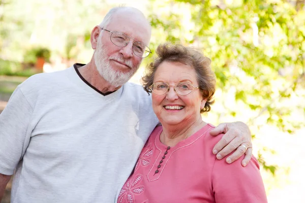 Loving Senior Couple Enjoying Outdoors Together Stock Photo