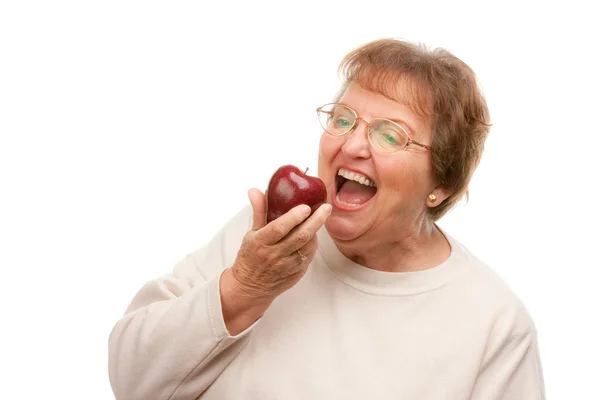 Attractive Senior Woman with Apple Isolated Stock Photo